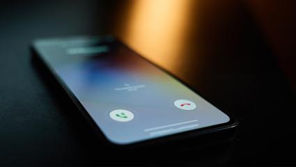 A smartphone lighting up as it receives a phone call