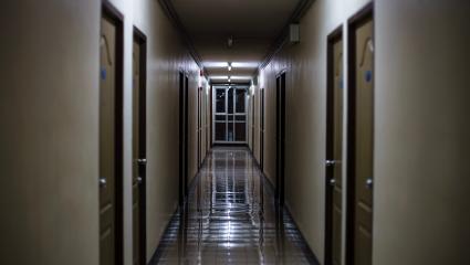 A dark dormitory corridor