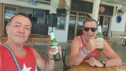 Paul Longworth and Albert Alfonso drinking beers together on holiday