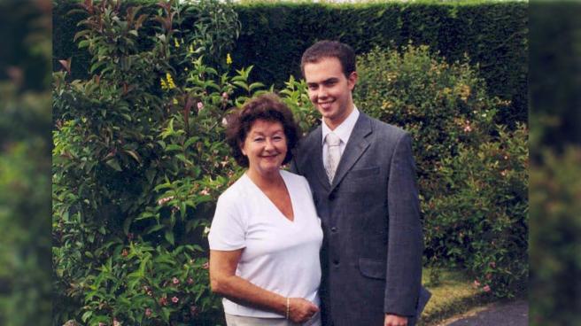 Brian Blackwell posing for a family photograph with his mother