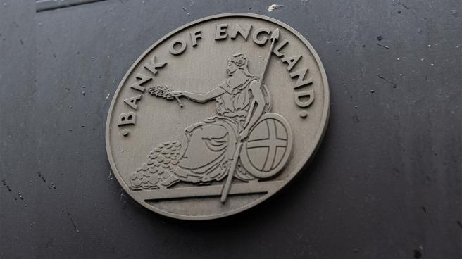 Bank of England crest on the side of a building
