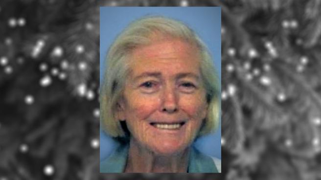 Police mugshot of Janie Lou Gibbs overlayed on a blurred, black and white image of a Christmas tree