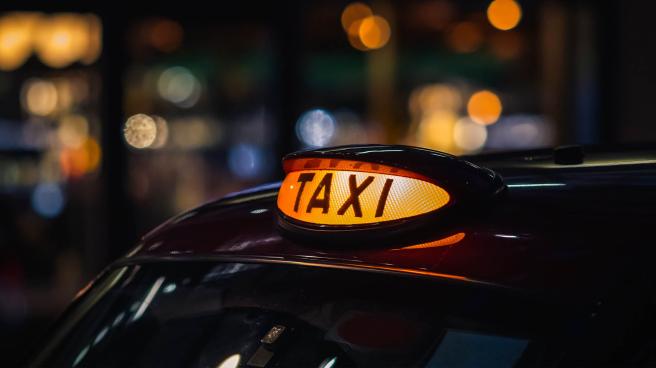 The light on top of a London taxi at night