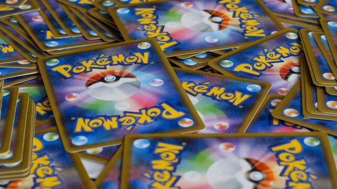A large number of Pokemon cards spread out face down