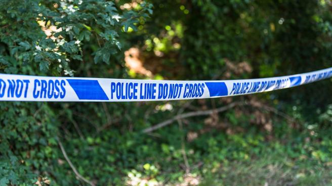 Police tape in a park