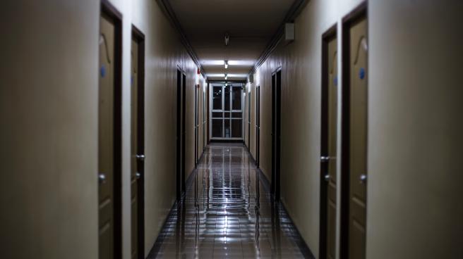 A dark dormitory corridor