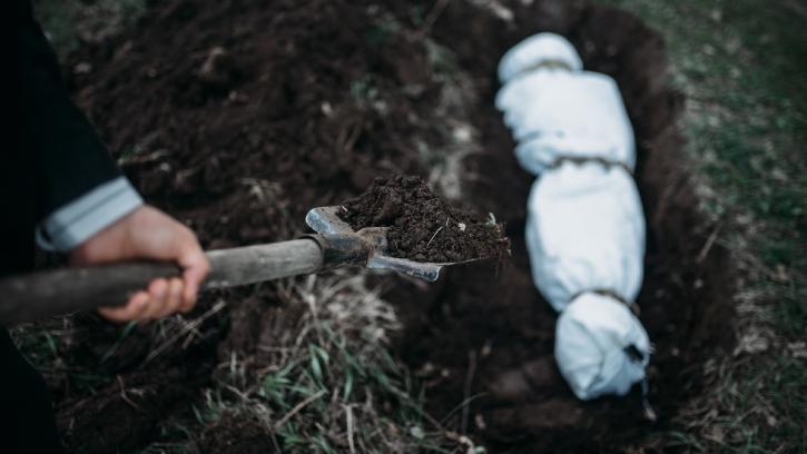Burying a body in a shallow grave