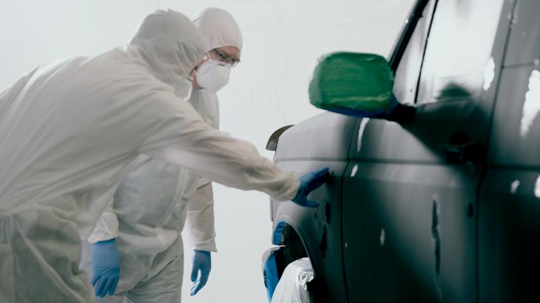 Forensic inspectors analysing a truck