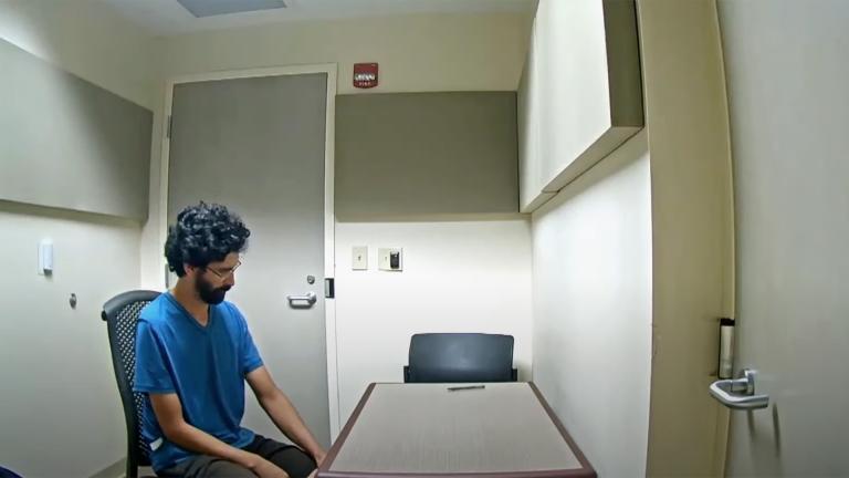 Reid Duran sits in an interrogation room