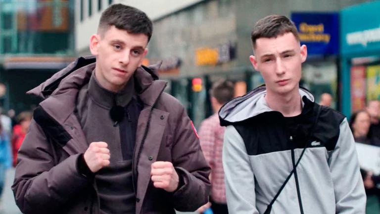 Two young men on the street of Glasgow