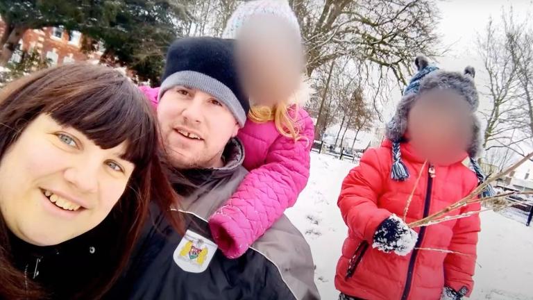 Kelly and George Worgan with their two children in a snowy scene