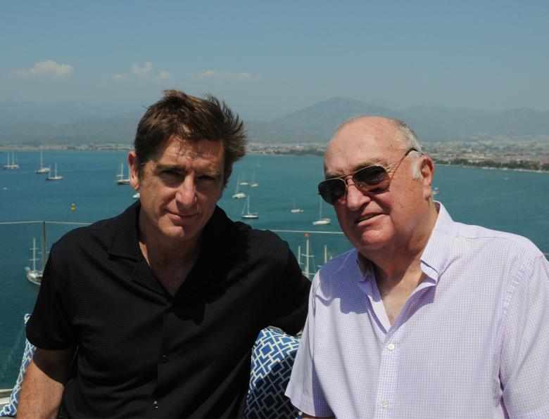 Marcel Theroux and Keith Cheeseman on a balcony overlooking the sea