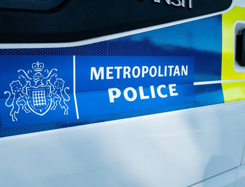 A Transit van with 'Metropolitan Police' branding on the side