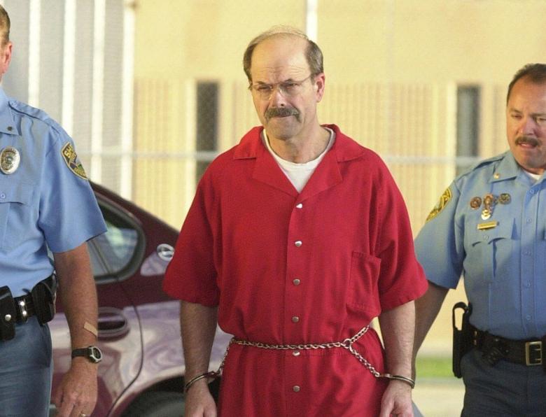 Dennis Rader escorted by deputies into a correctional facility in Kansas, United States