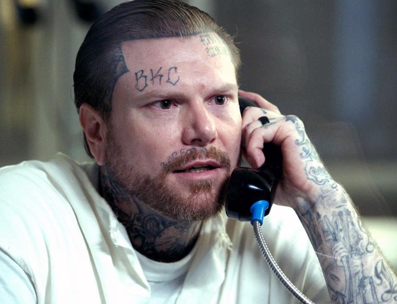 Adam Williams speaking on a prison phone during an interview