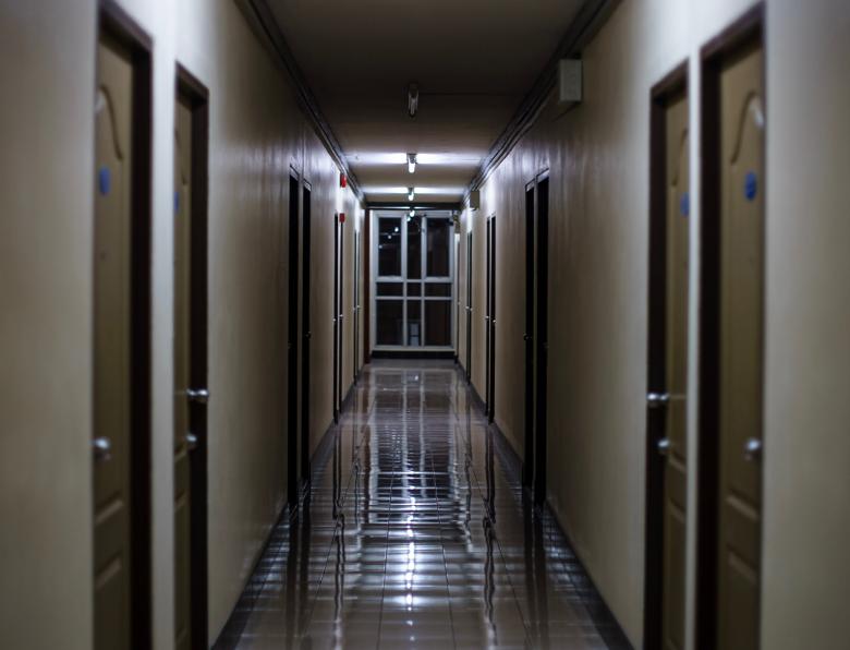 A dark dormitory corridor