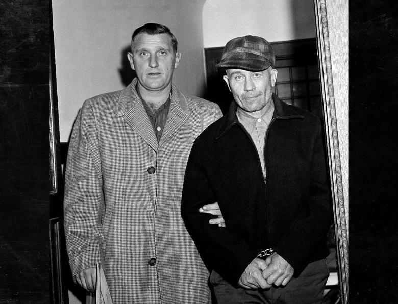 Waushara County Sheriff Art Schley (left) escorts Edward Gein (right) into Central State Hospital on the 23rd November,1957, in Milwaukee, USA.