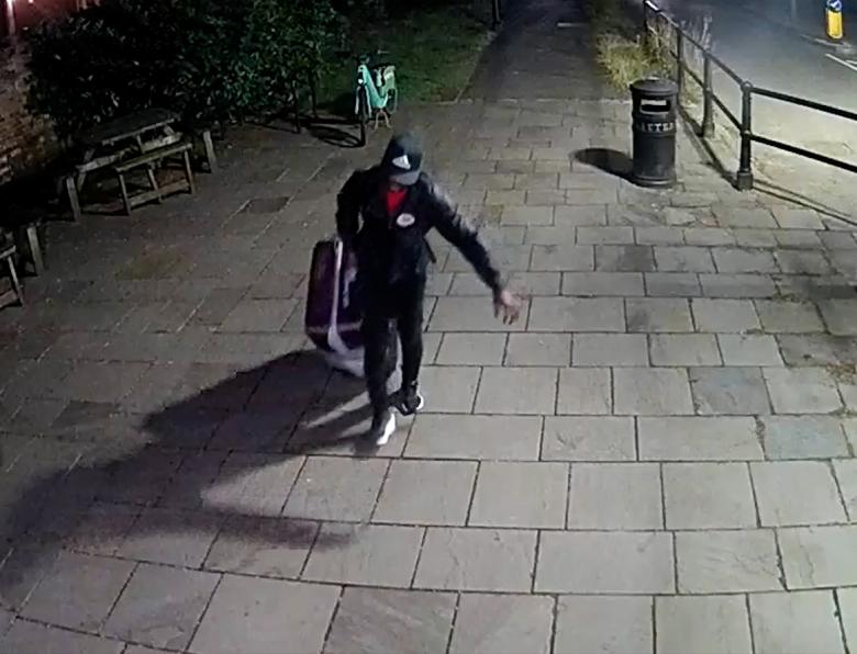 CCTV of Yostin Andres Mosquera wheeling a suitcase across the bridge