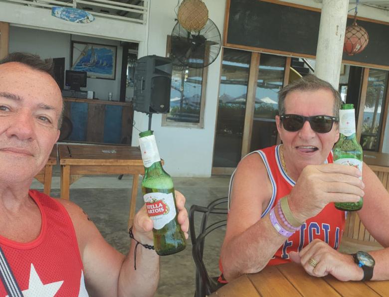 Paul Longworth and Albert Alfonso drinking beers together on holiday