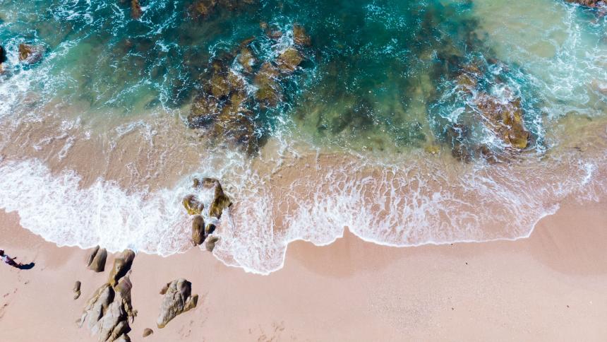 Aerial photo of Mazatlan beach Mexico with waves flowing over the shore