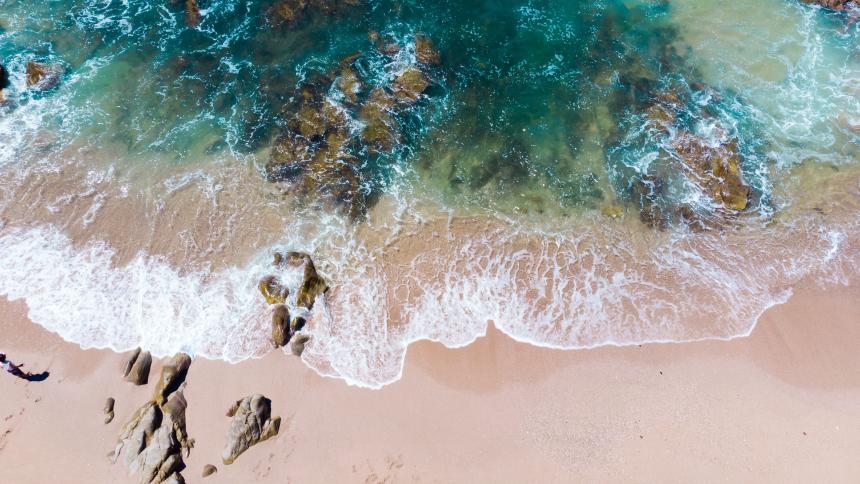 Aerial photo of Mazatlan beach Mexico with waves flowing over the shore