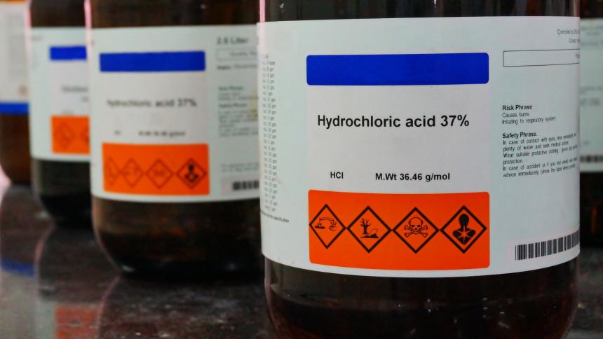 A stock photo showing bottles of Hydrochloric Acid (HCL).
