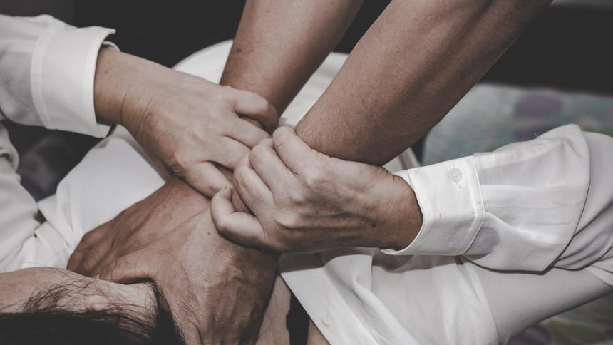 A stock photo of someone being strangled