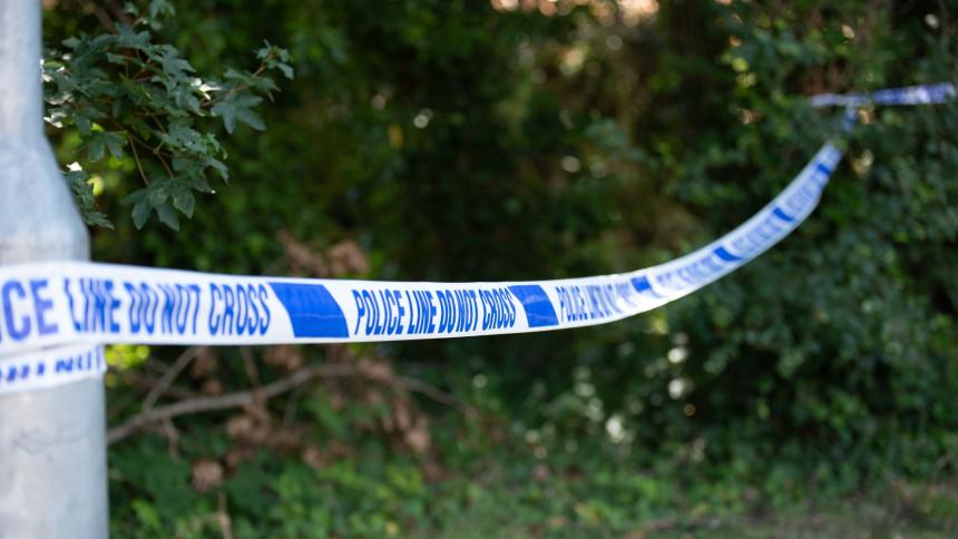 A photograph of UK police crime scene tape