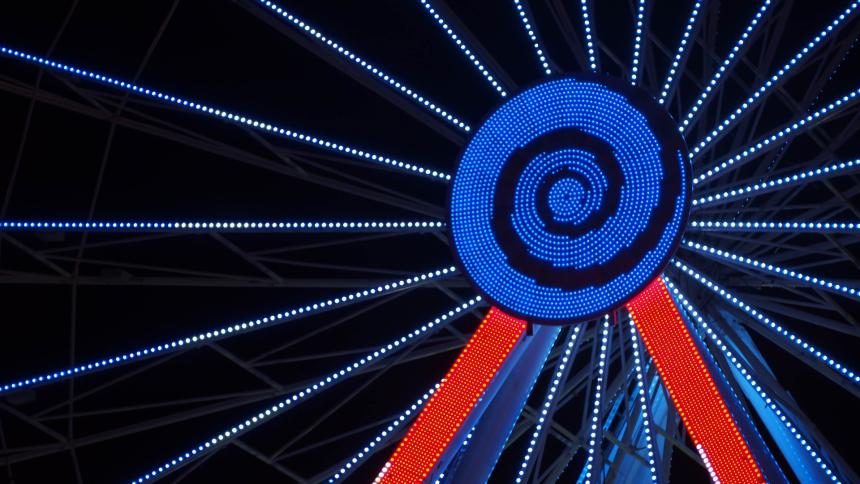 A photograph of a fairground Ferris Wheel