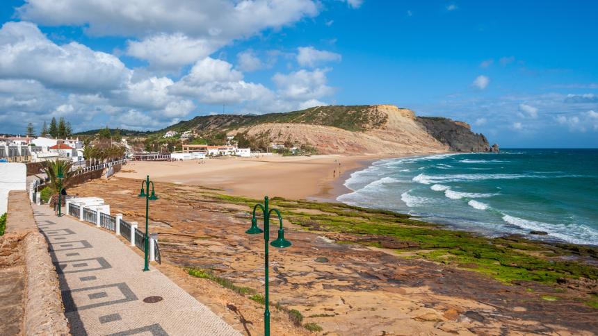 A photograph of the waterfront of Praia da Luz, in the Algarve region, Portugal