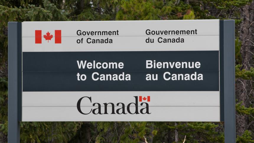 A photograph showing a 'Welcome to Canada' sign