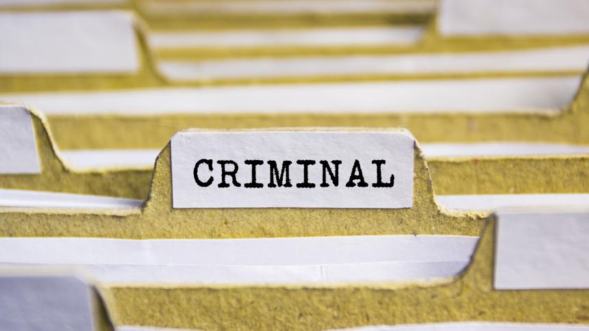 A photograph showing criminal records / criminal files. 