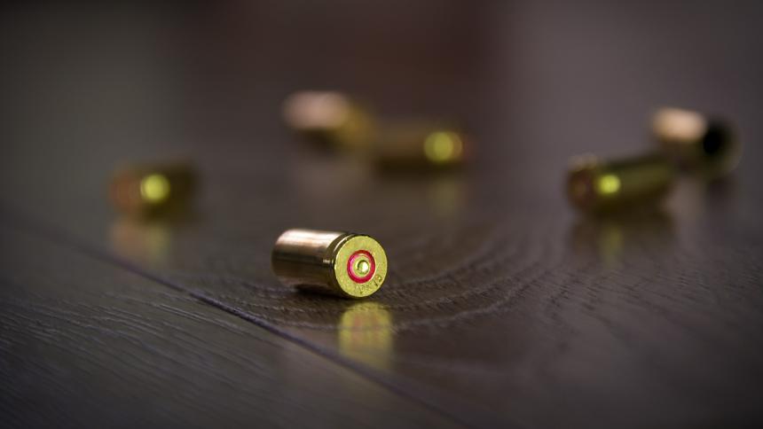 A photograph of bullet casings on a table