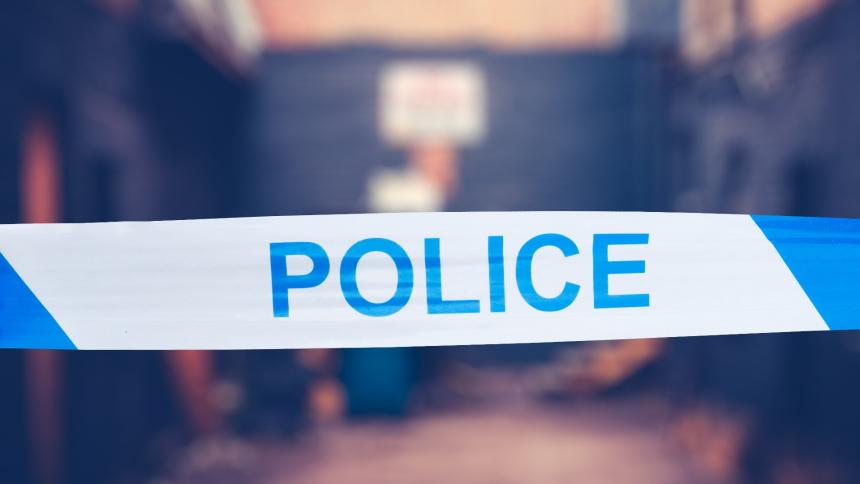 A generic photograph showing police tape at a crime scene