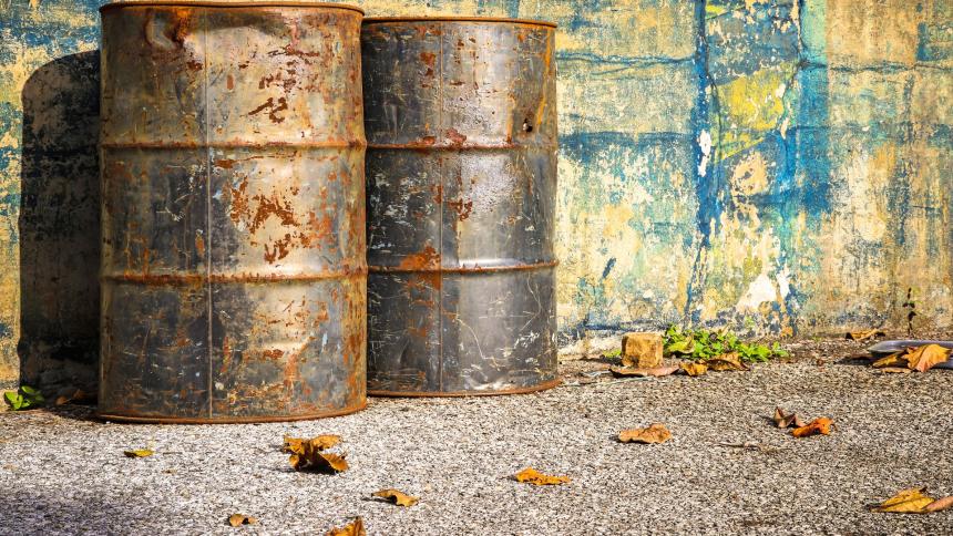 A photograph of old rusty oil drums 
