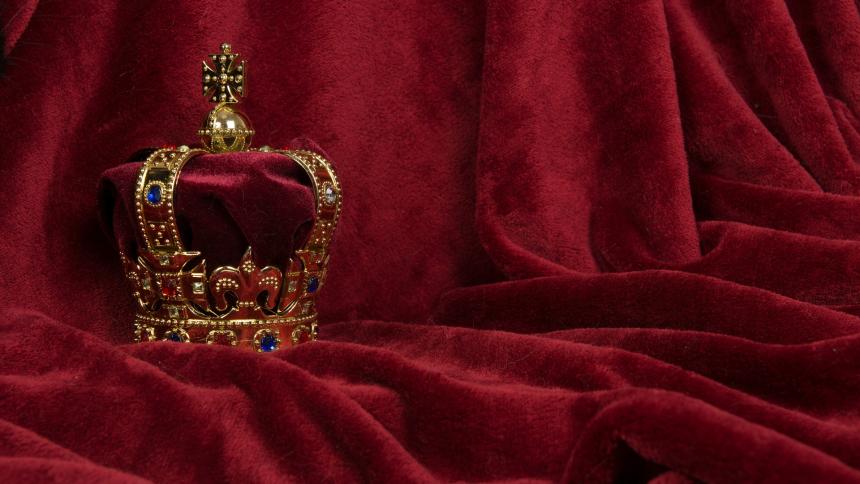 A stock photo of royal jewels and a jewel encrusted crown