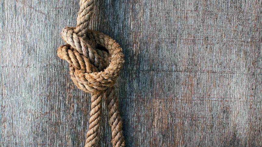 A stock image of a knot in a piece of rope