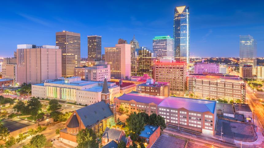 A stock image showing Oklahoma City, Oklahoma, USA downtown skyline at night.