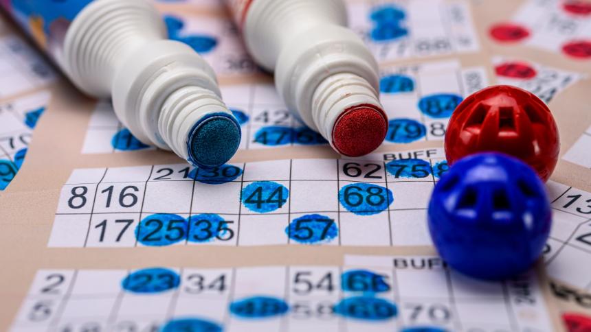 A stock image of a bingo card and bingo dabber