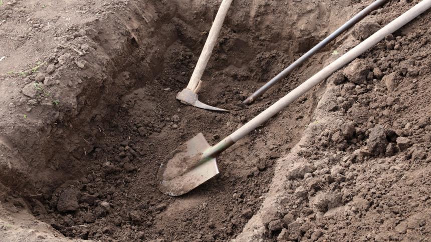 A stock image of a hole being dug in the soil