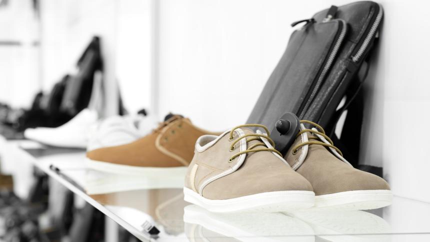A stock image of a shoe department in a shop