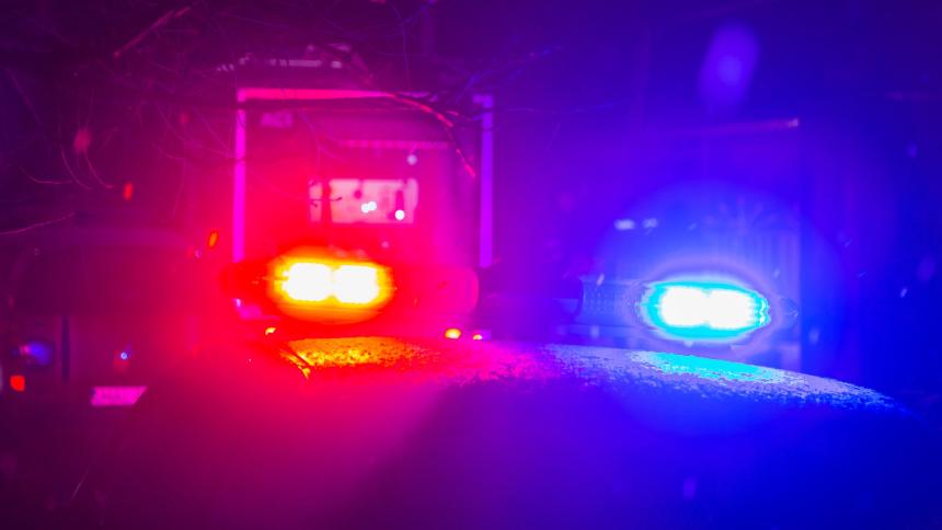 A stock image showing police lights on top of a police car