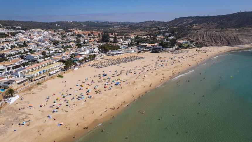 A stock drone aerial photo of Praia Da Luz beach in Lagos, Portugal
