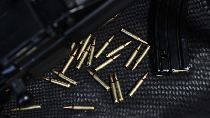 A stock image of weapons and bullet shells