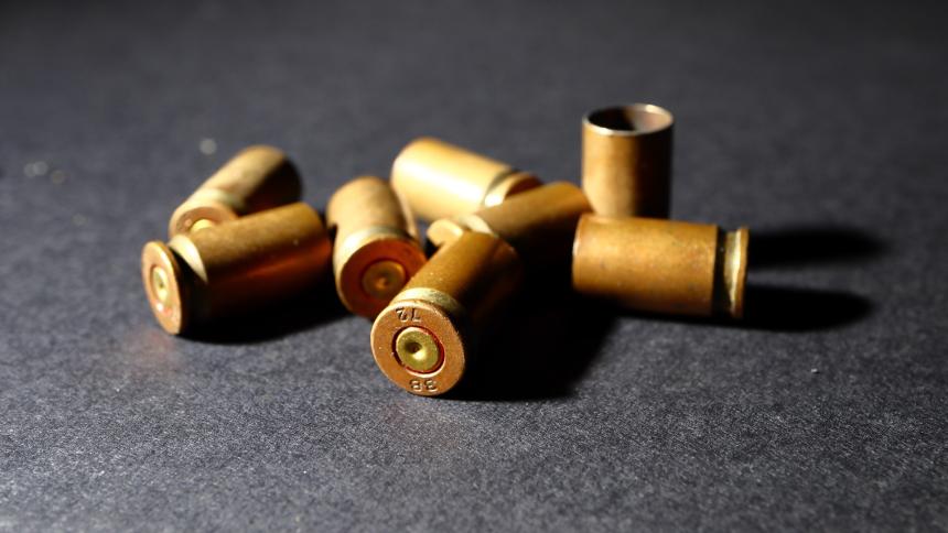 A stock photo of bullet shells on the ground