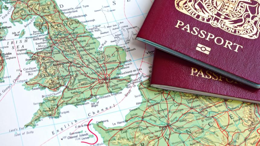 A stock image of a British passport and a map of the UK