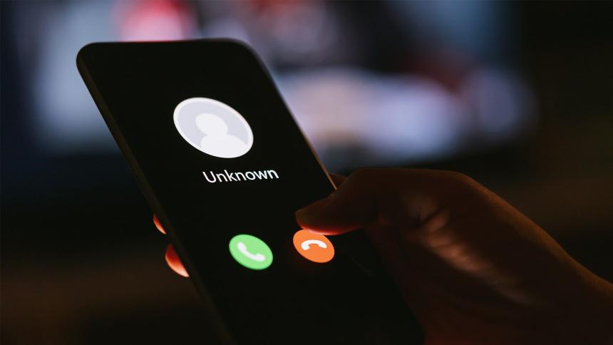 A smartphone showing a phone call from an unknown number