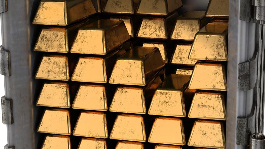 Gold bars stacked up in a safe
