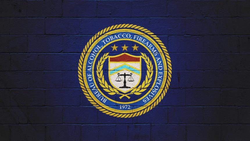 The ATF (Bureau of Alcohol, Tobacco, Firearms and explosives) logo painted on a brick wall.