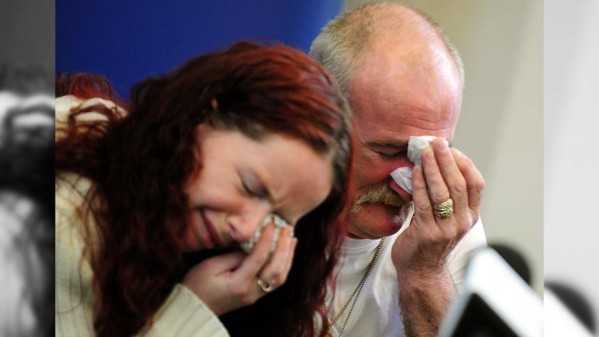 Mick and Mairead Philpott crying while talking to the media